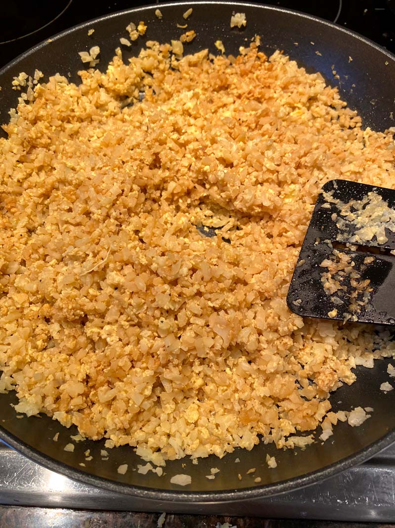 cauliflower fried rice in a pan