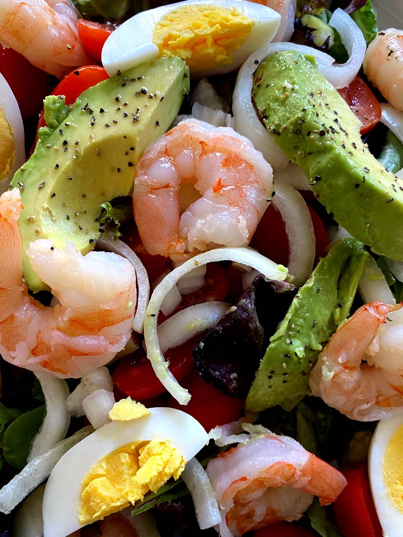 A close-up of shrimp egg avocado salad 
