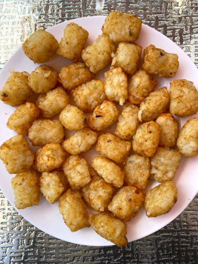 air fryer tater tots served on a white plate