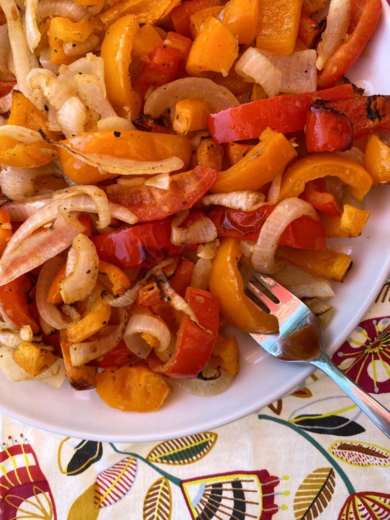 serving bell peppers and onions with a fork.