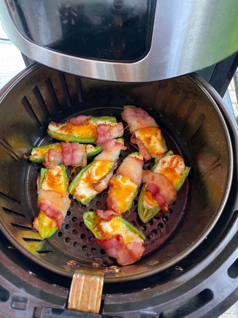 jalapeno poppers inside the air fryer basket 