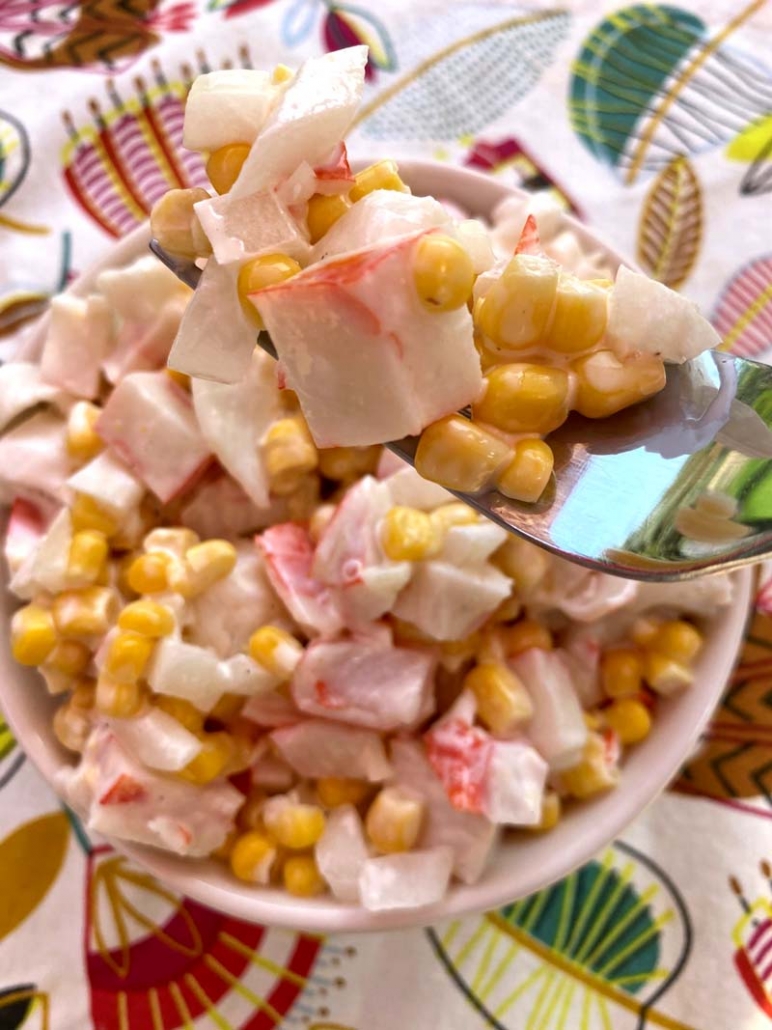 A spoonful of crab and corn salad 