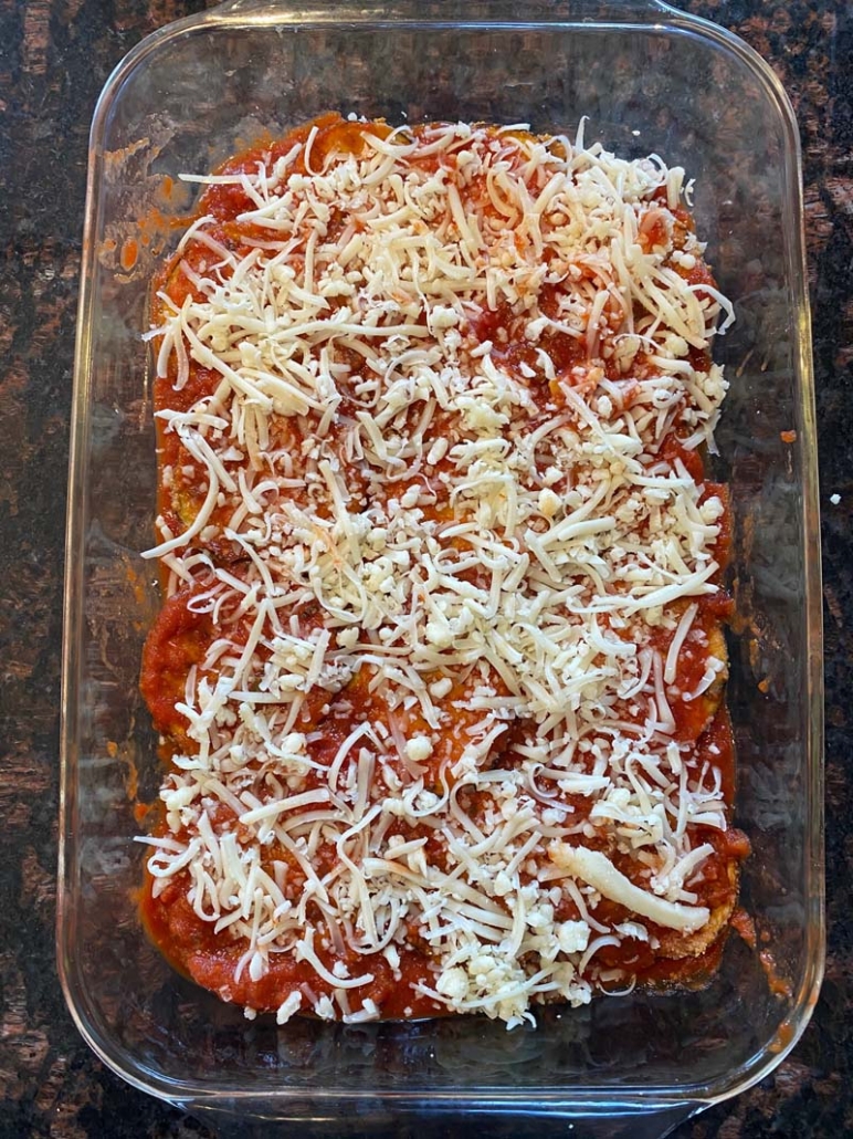 Shredded cheese layer of eggplant parmesan