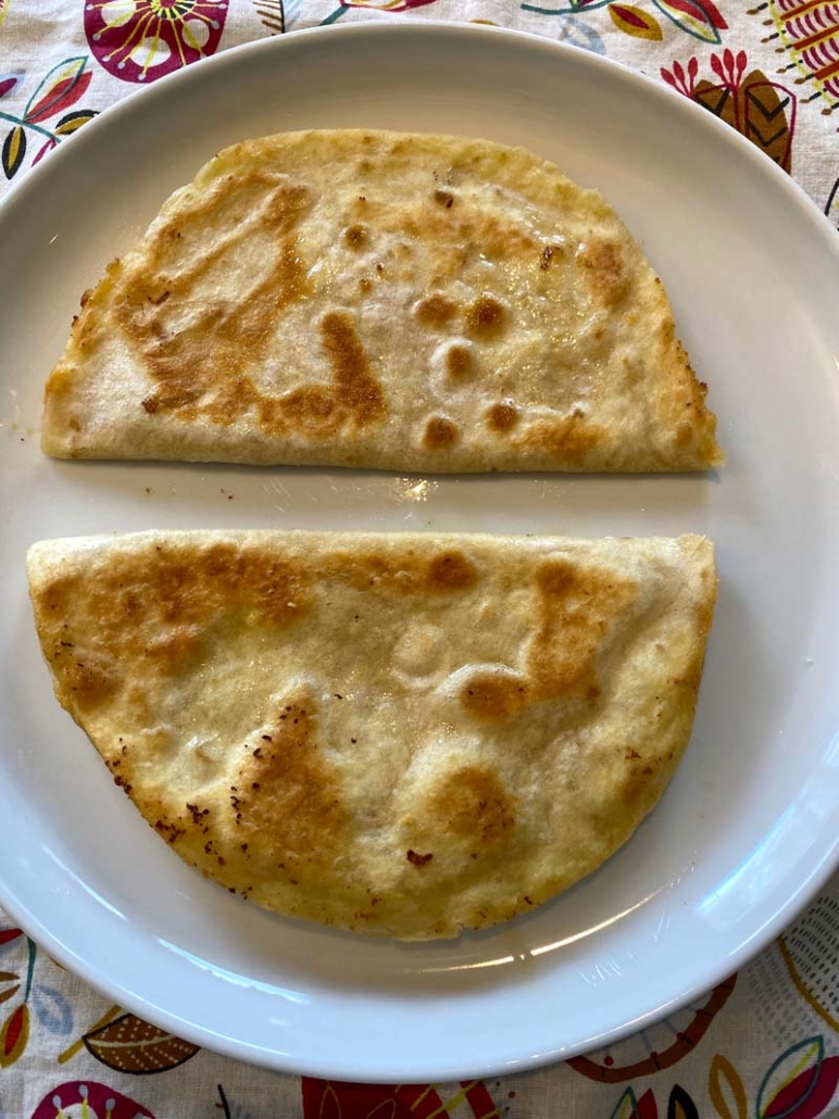 Two hummus quesadillas on a plate