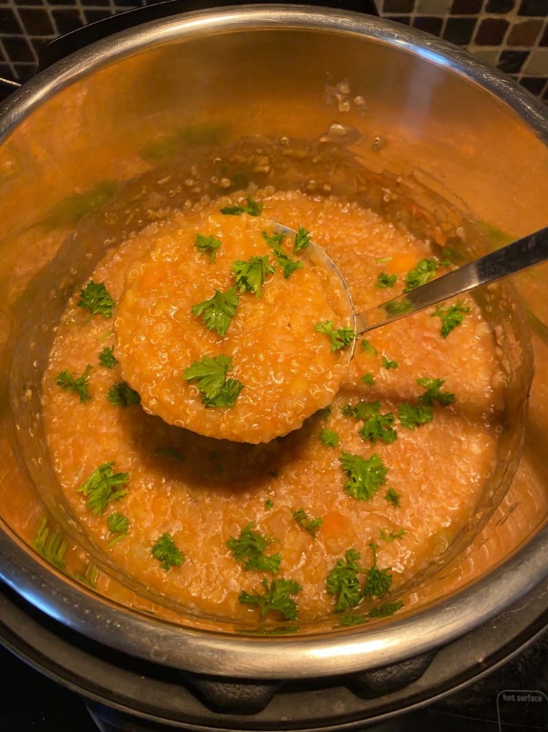 Scooping out Instant Pot Lentil Quinoa Soup