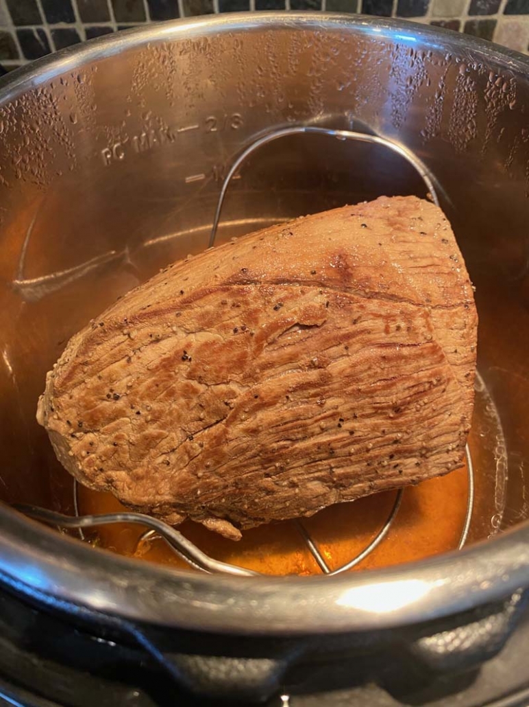 Putting the eye of round roast in the Instant Pot 