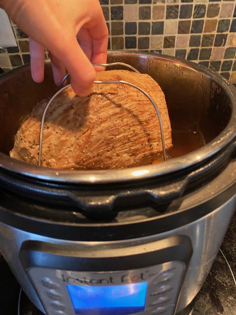 Pulling a roast out of an Instant Pot 