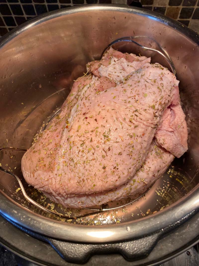 Raw seasoned turkey breast in an Instant Pot