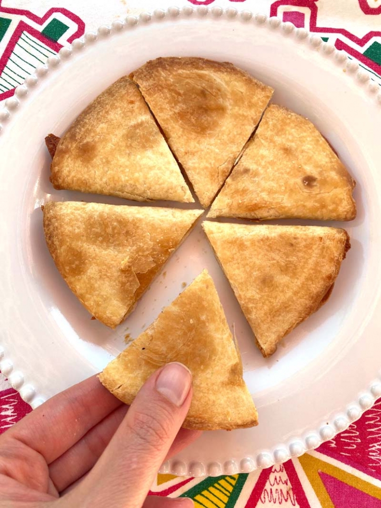 sliced quesadilla on a white plate 