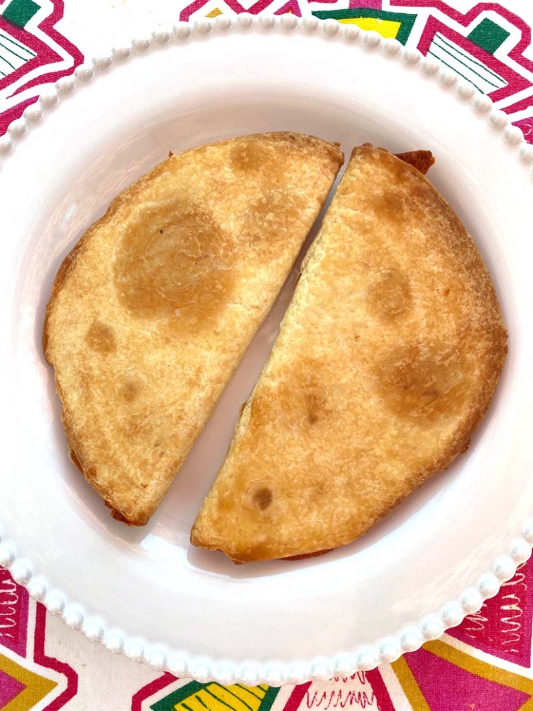 2 air fried cheese quesadilla on a white plate