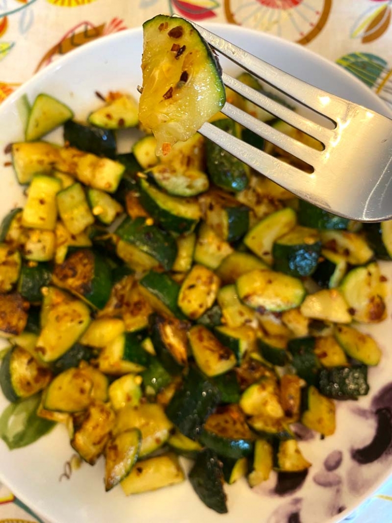 eating zucchini with a fork 