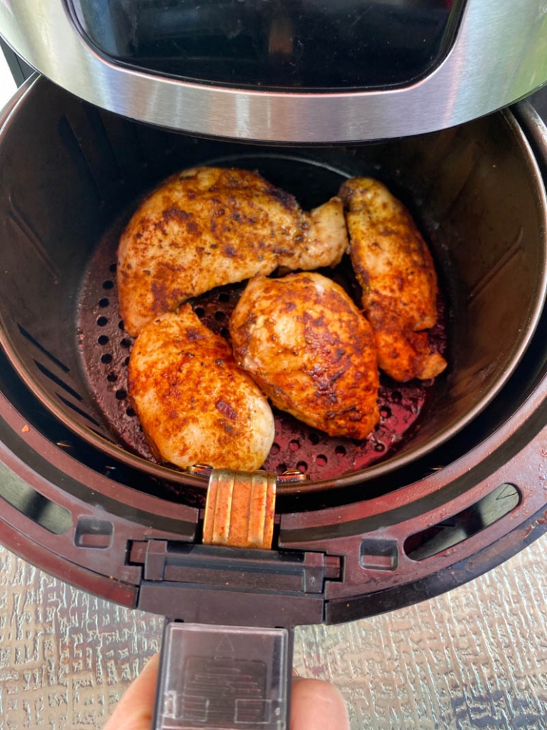 boneless chicken in an air fryer basket 