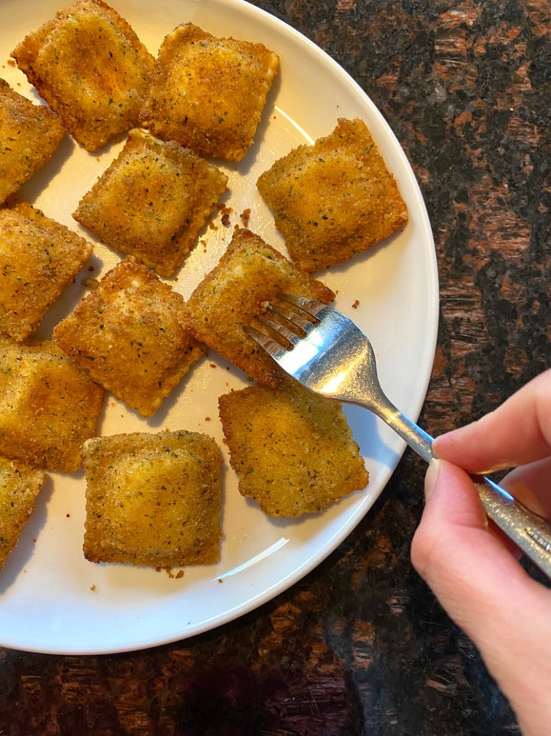 eating one ravioli with a fork