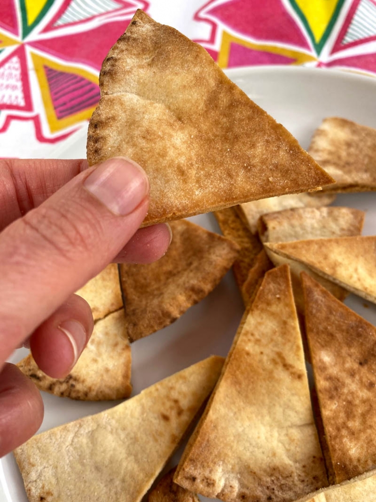 eating an air fried pita chip 