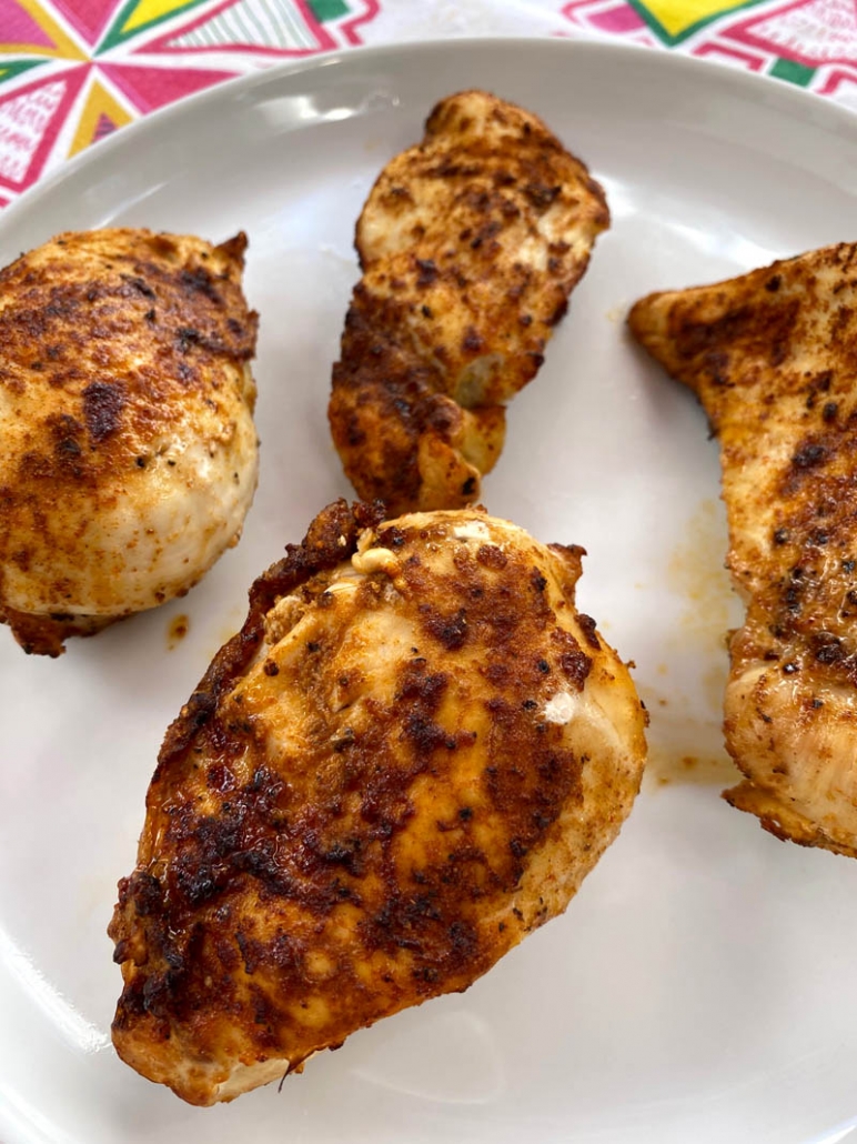 air fried chicken breasts on a white plate