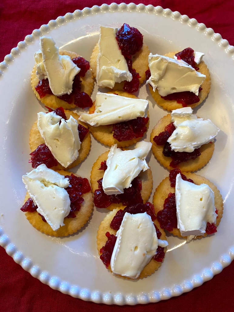 cranberry cheese bites on a white plate 