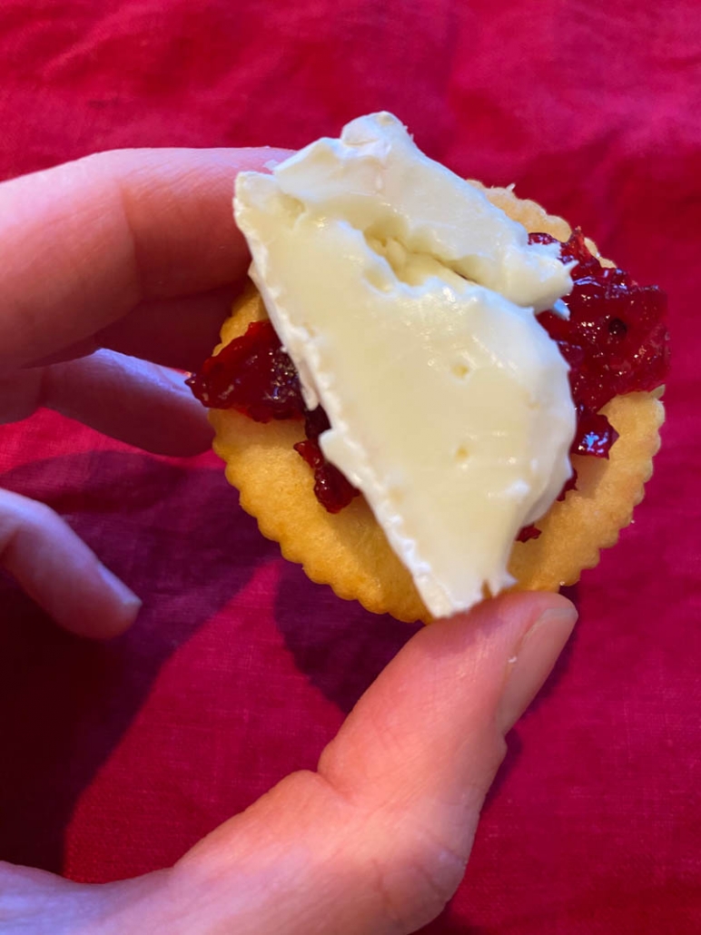 cranberry and brie cheese on a ritz cracker 