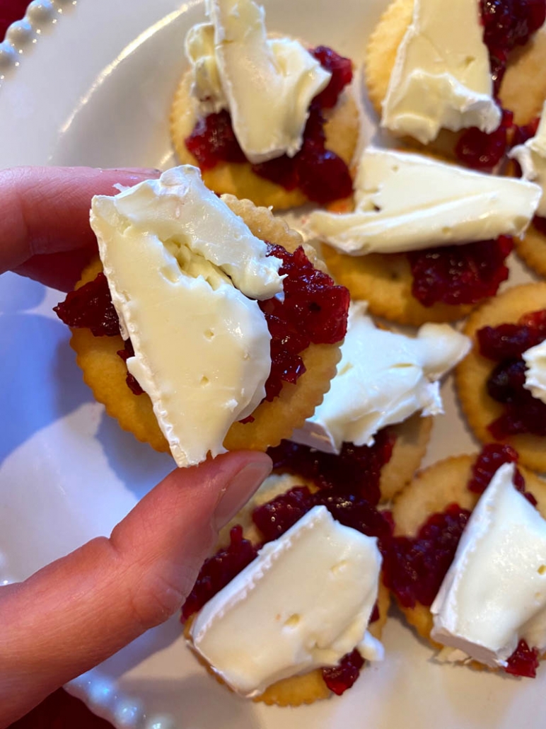 brie cheese and cranberry on a butter cracker