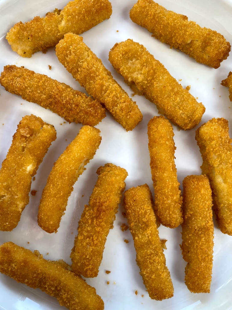 fish sticks on a white plate 