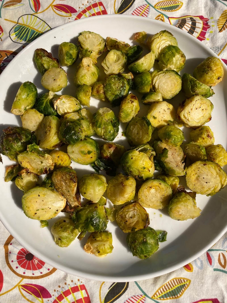 brussel sprouts on a white plate 