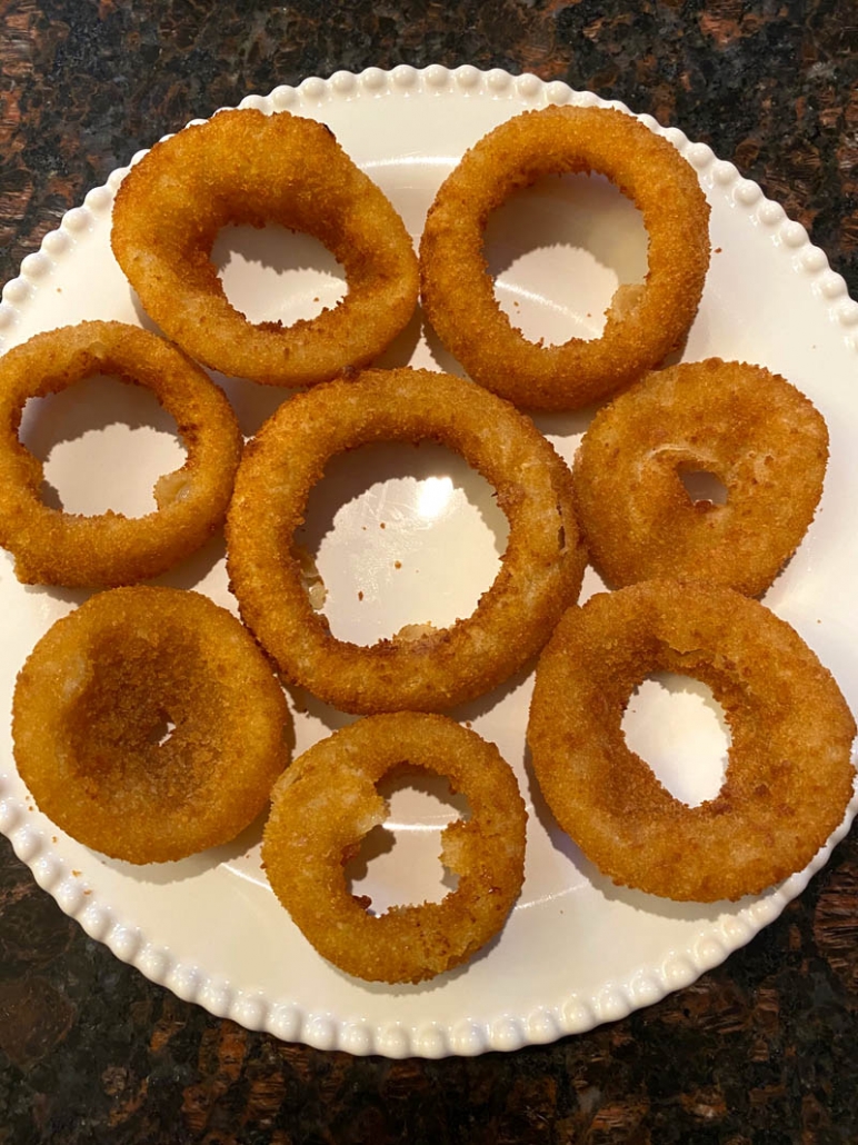 onion rings on a white plate 