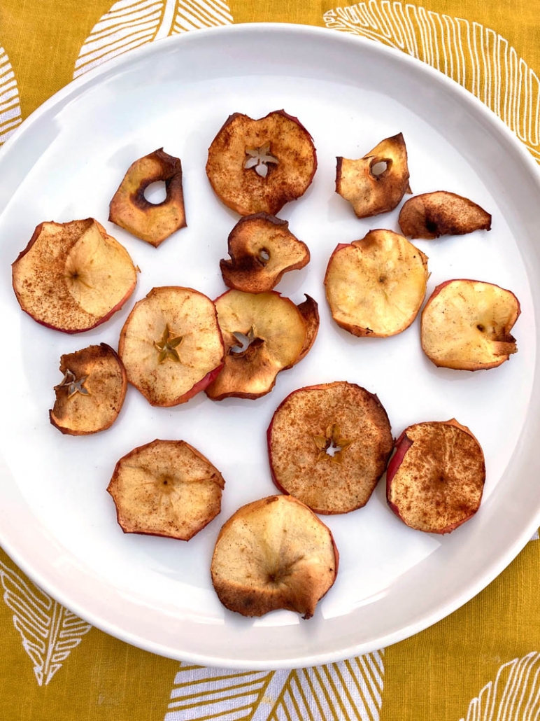 crispy apple chips on a white plate