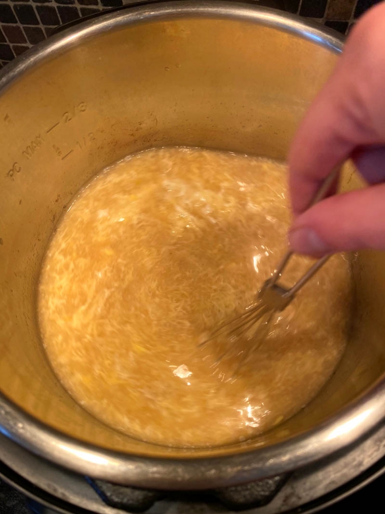 whisking eggs into soup
