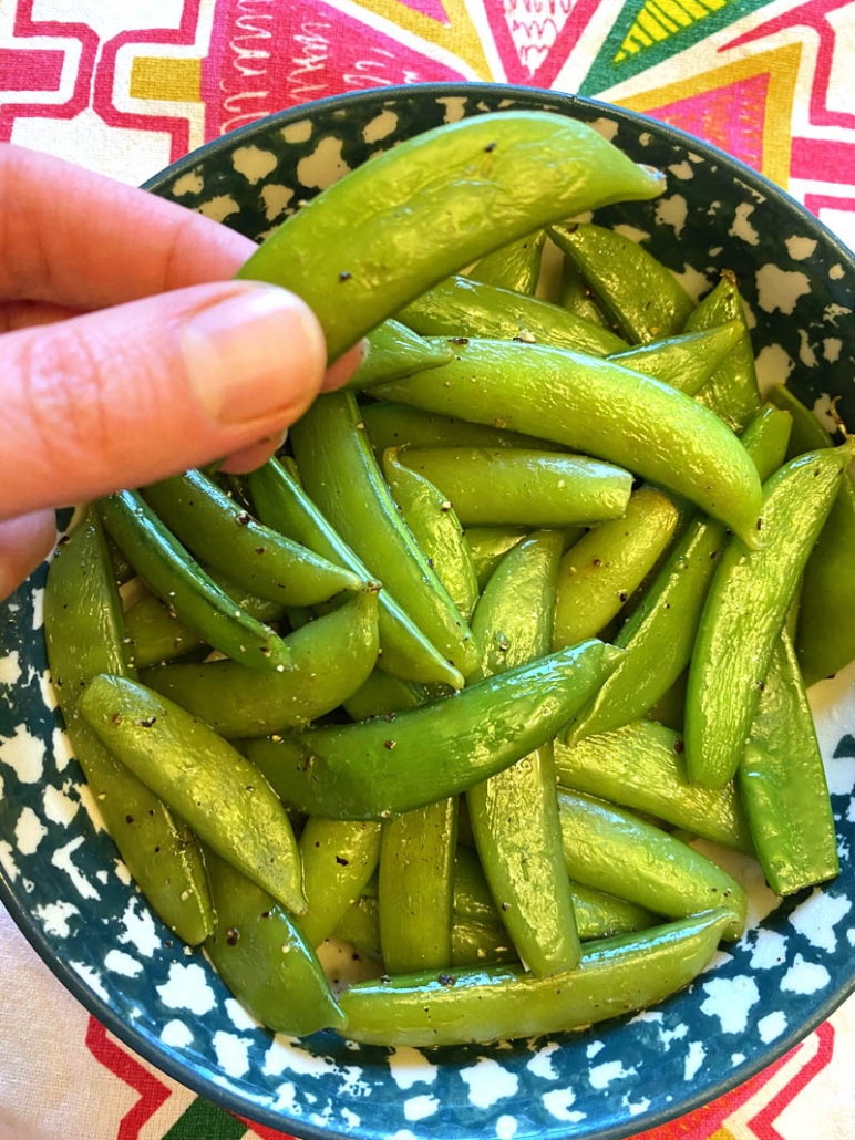 eating seasoned snap peas 