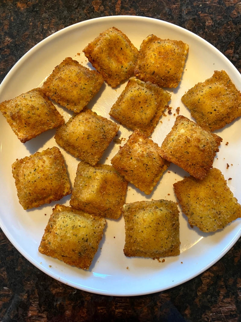 air fryer toasted ravioli on a white plate 