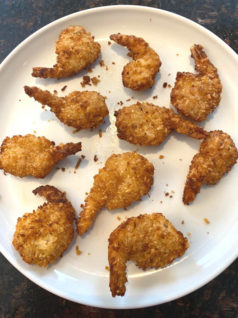 coconut shrimp on a white plate 