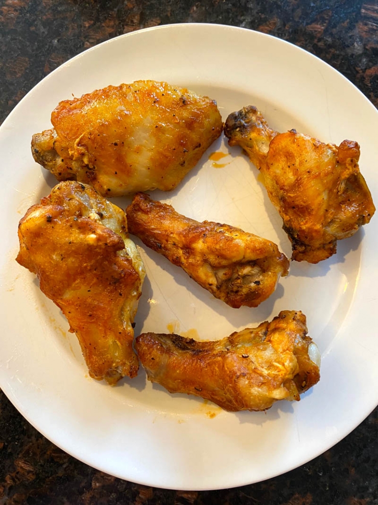 buffalo wings on a white plate 