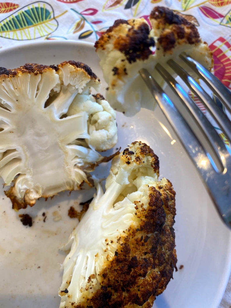 Eating roasted cauliflower 