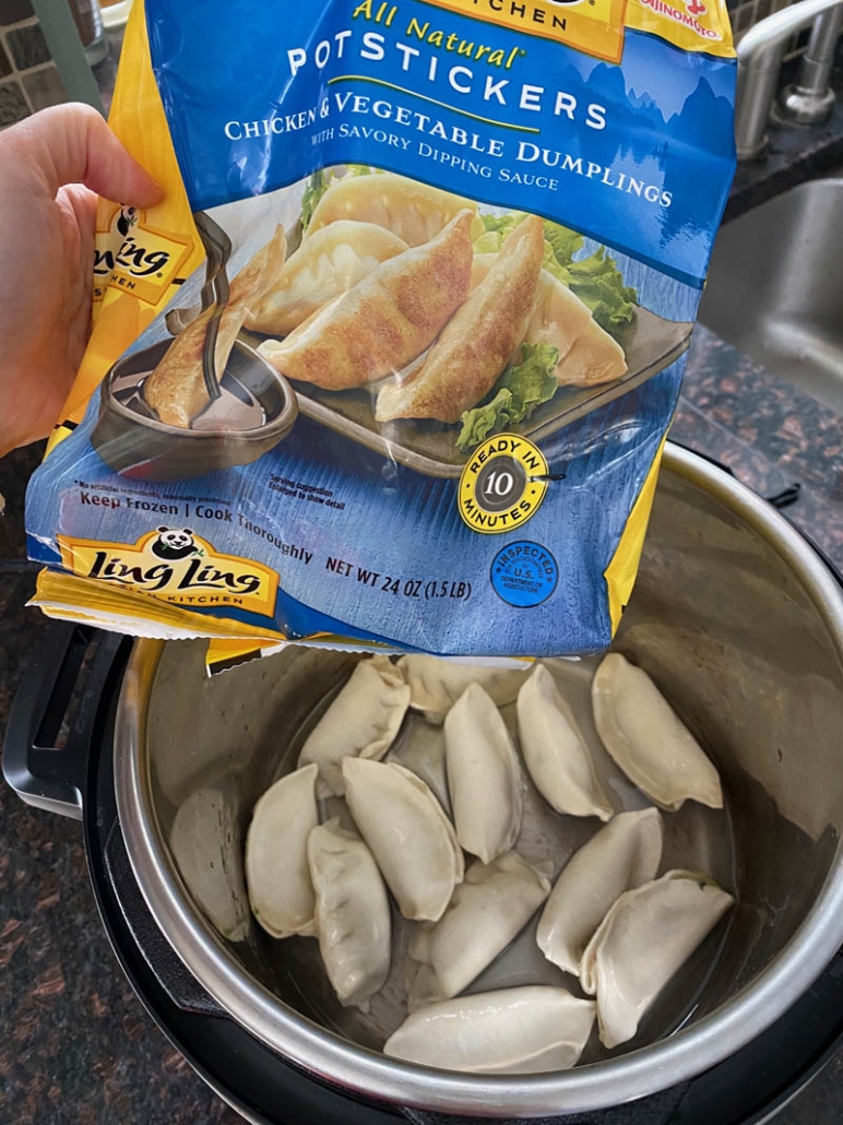 pouring bag of potstickers to pot
