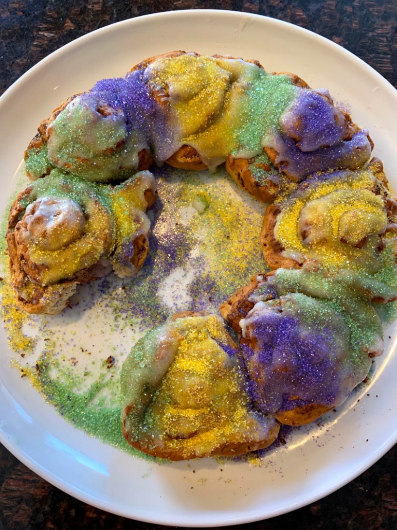 white plate holding king cake with one missing 