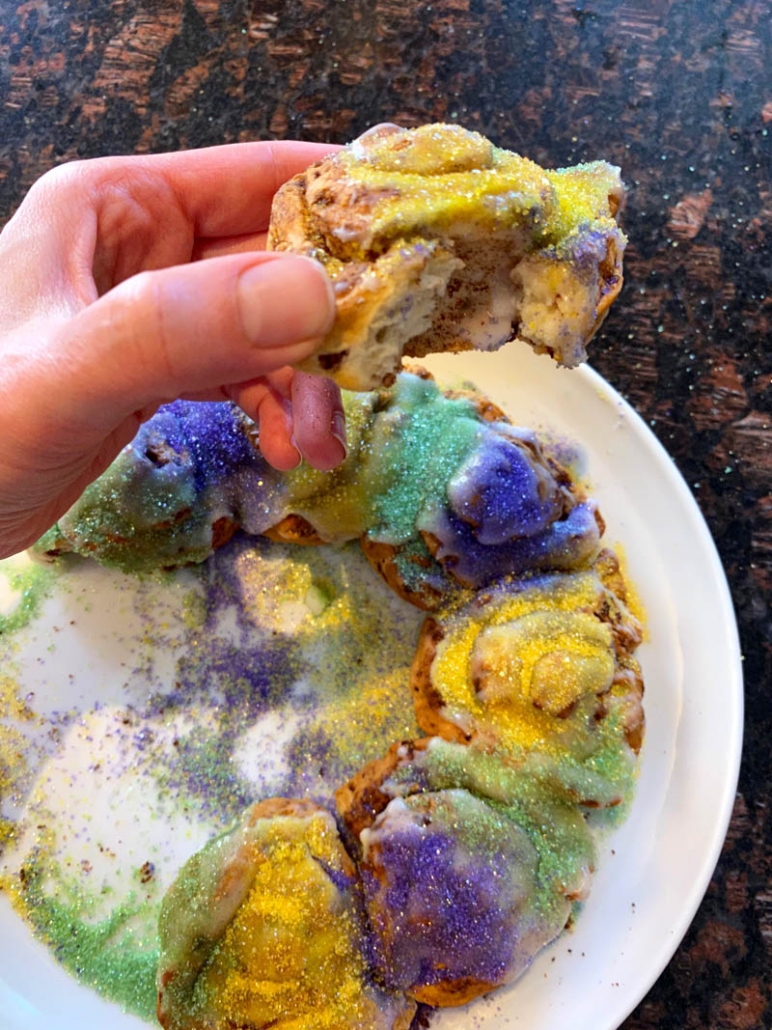air fryer mardi gras king cake with bite taken out of one 