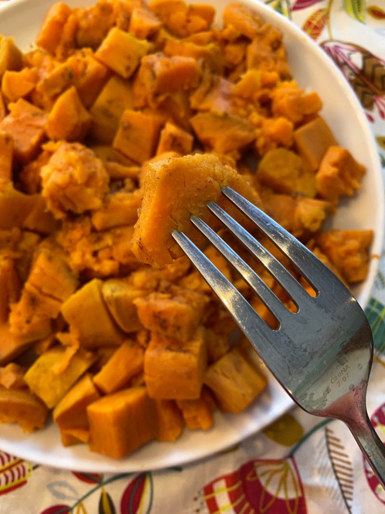Steamed sweet potatoes on a white plate 