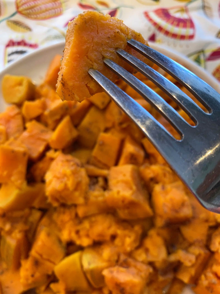 A fork with steamed sweet potatoes