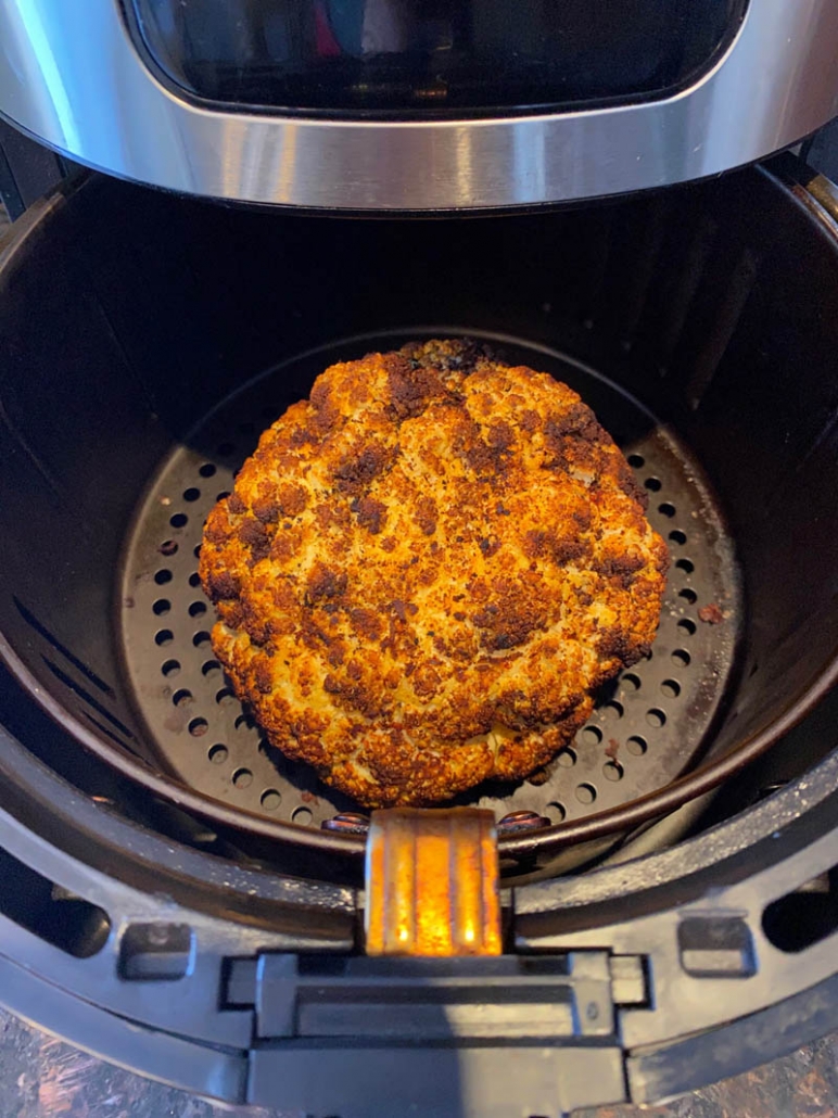 A whole head of cauliflower roasted in the air fryer 