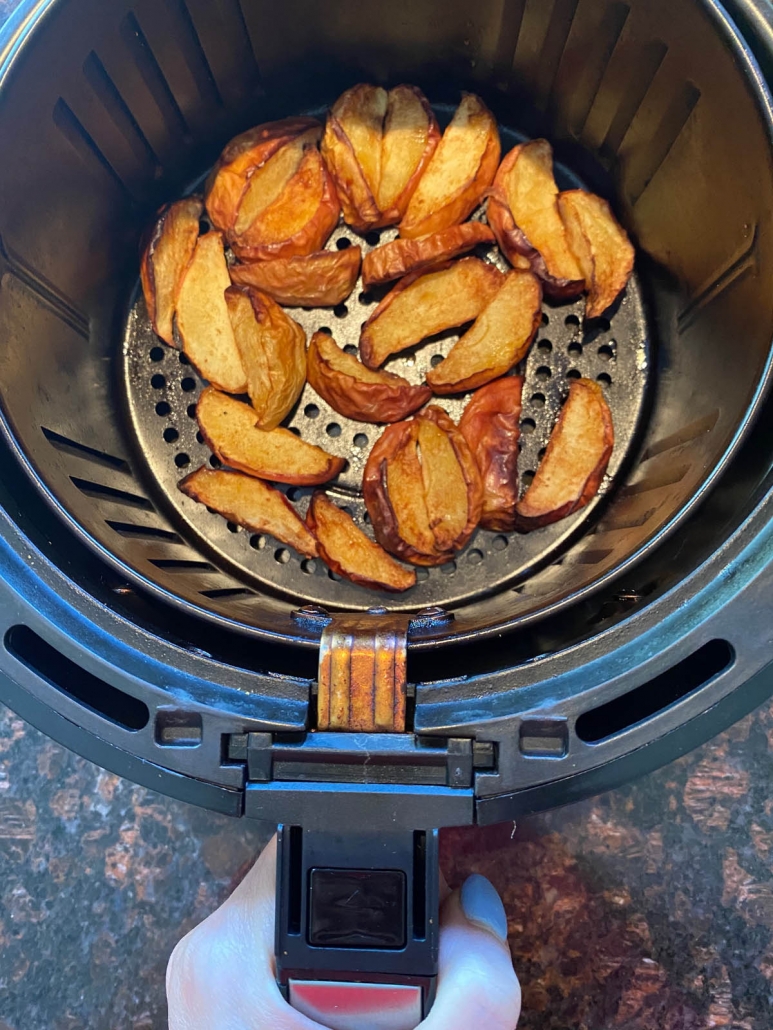 cinnamon apple slices in the air fryer basket 