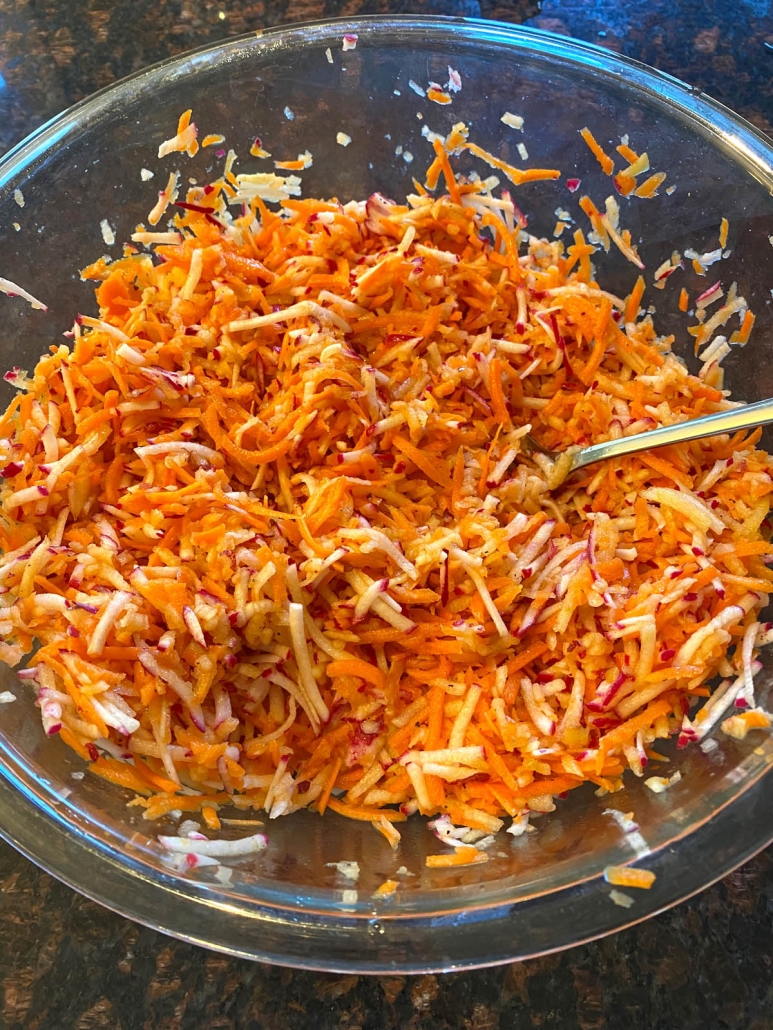 mixing veggies and dressing 