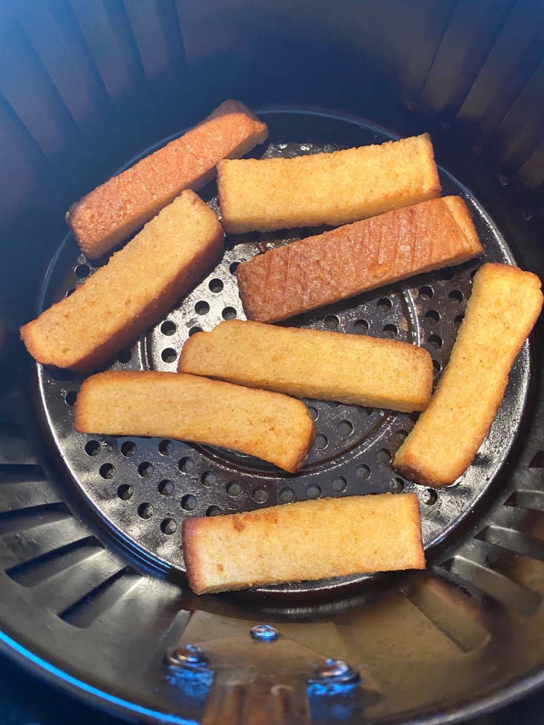 close up of french toast sticks in air fryer