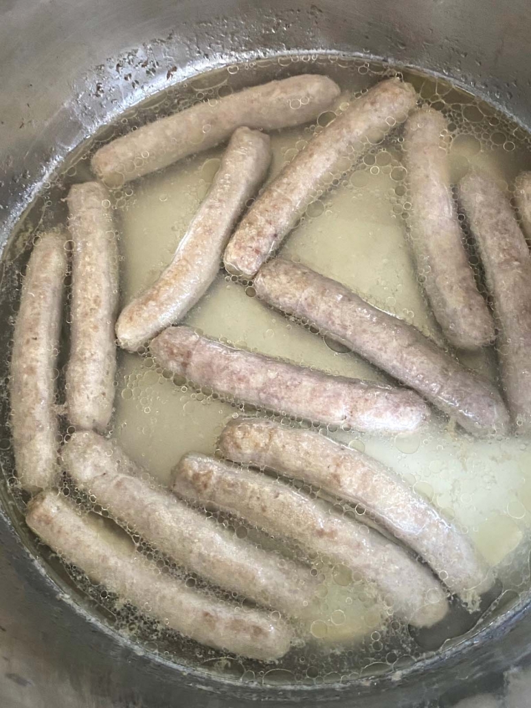close up of sausages in instant pot with water