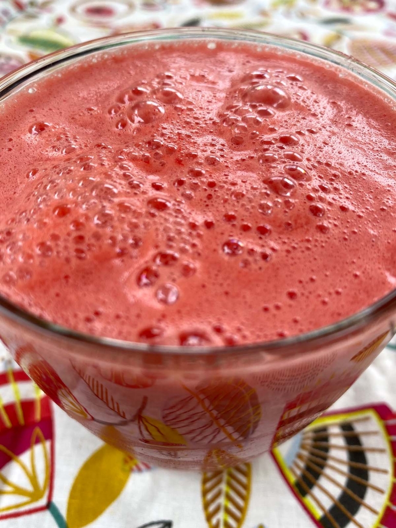 close up of glass of watermelon smoothie