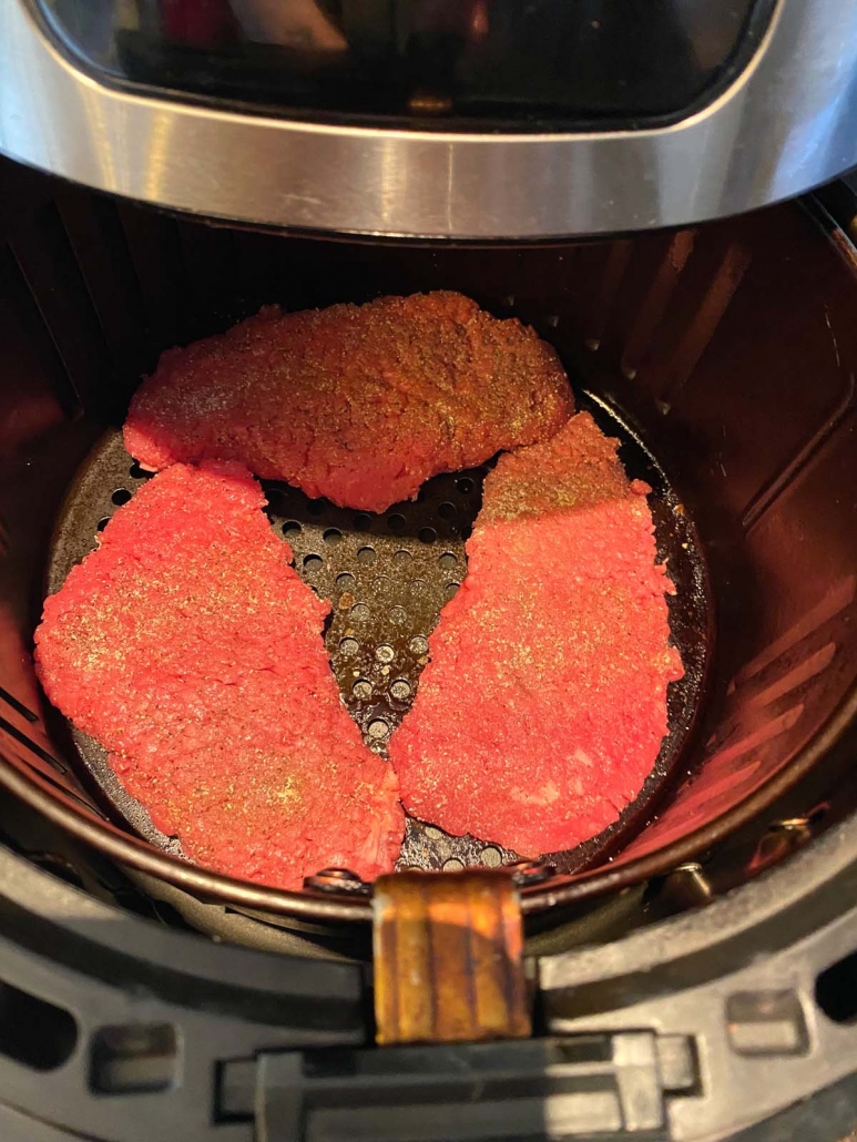 three pieces of cube steak in the air fryer