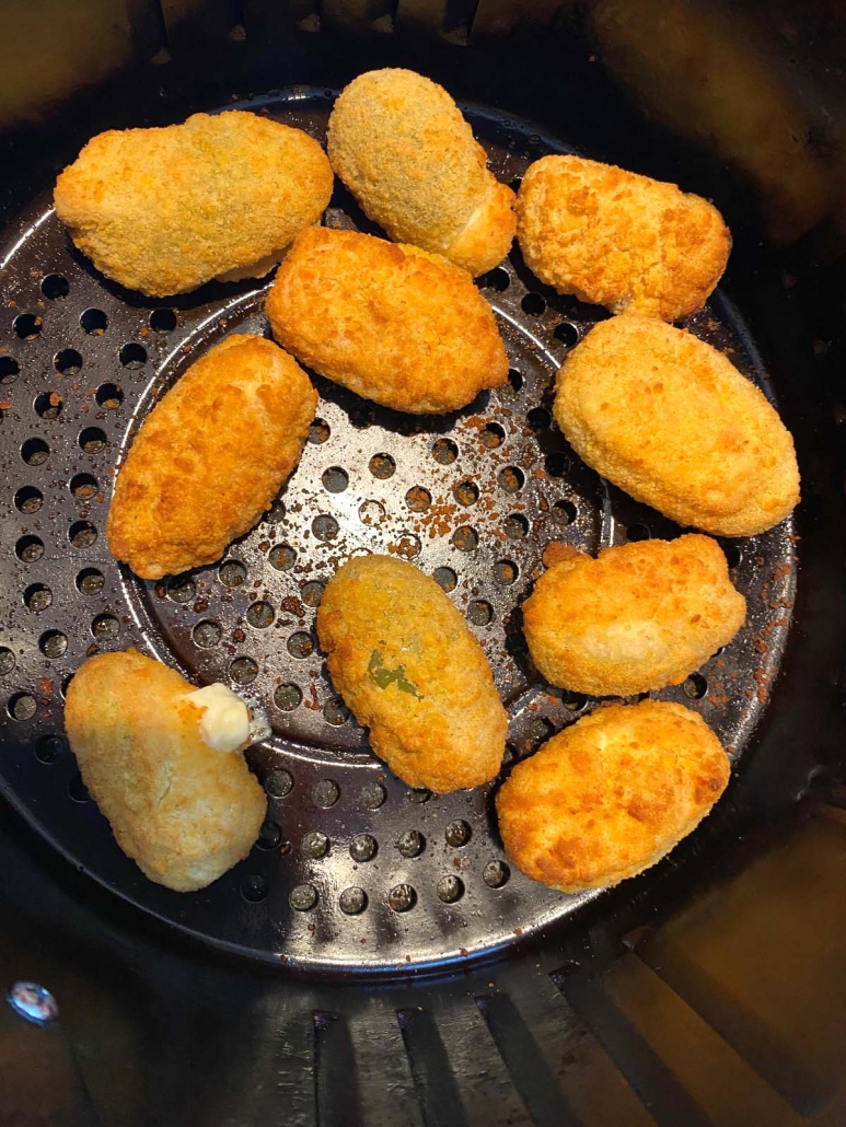 close up of jalapeno poppers in the air fryer