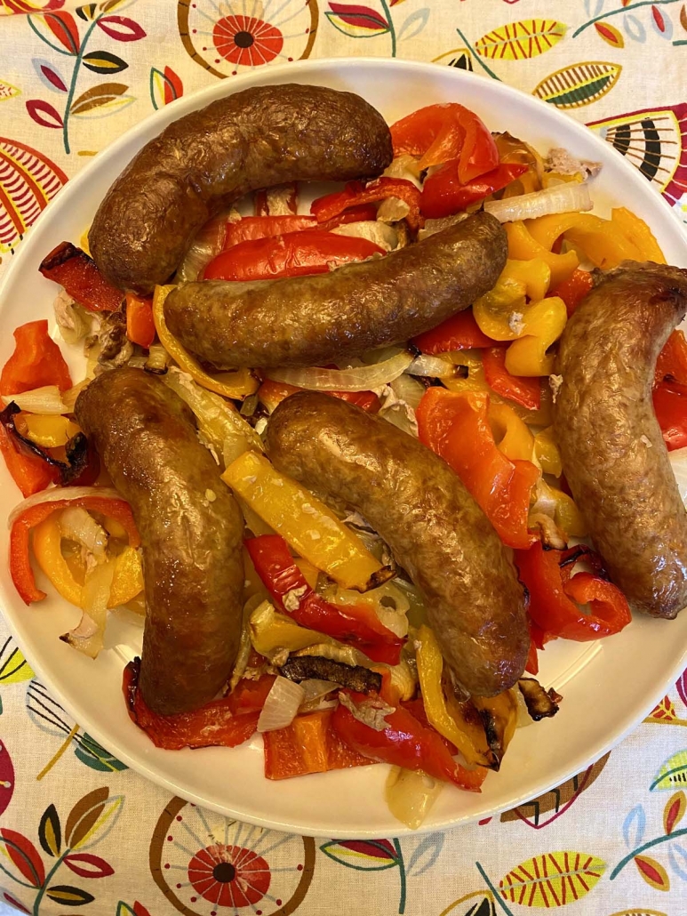 sausages, peppers and onions on a plate 