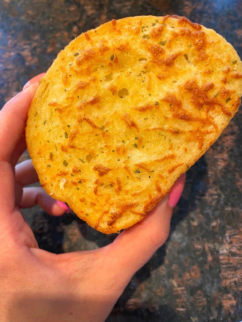 hand holding cooked slice of texas toast