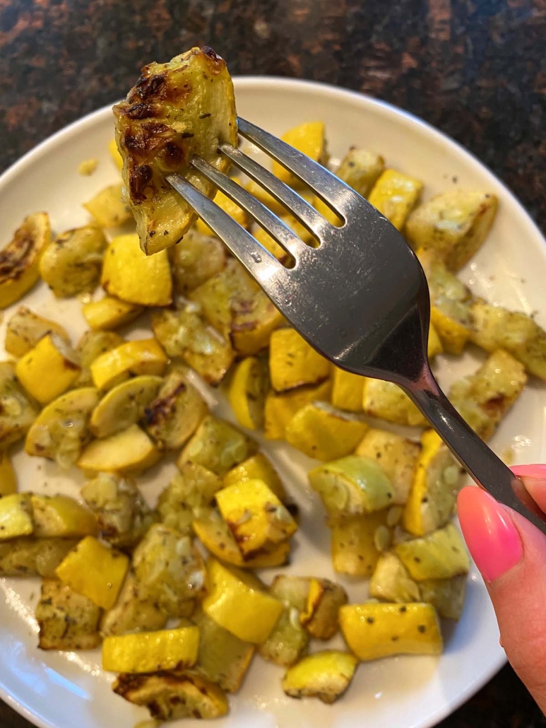 eating a bite of summer squash
