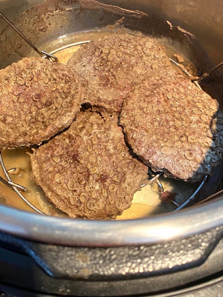 close up of cooked burgers in the instant pot