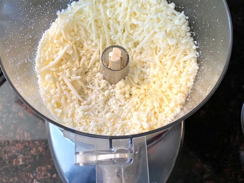 https://www.melaniecooks.com/wp-content/uploads/2021/10/shredded-cheese-in-food-processor-6-500x375.jpg